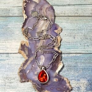 Kukuri Silver Necklace with Red Rhinestone Pendant.